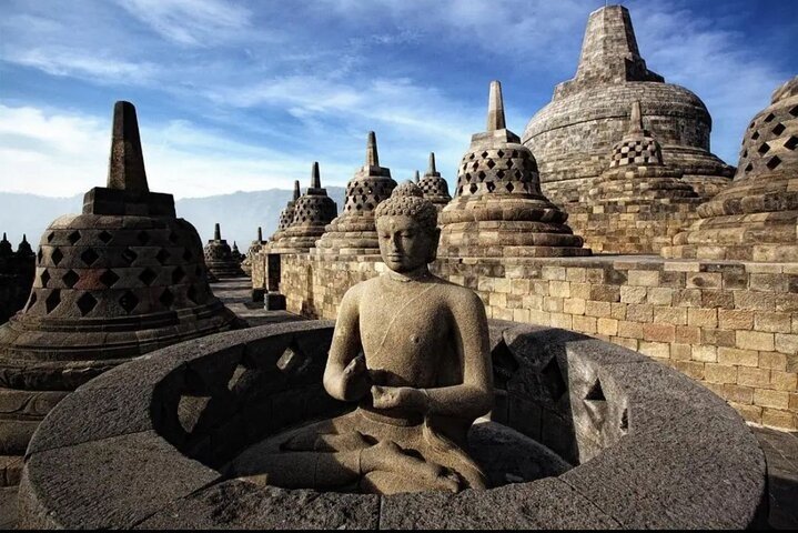 Borobudur Temple perforated stupas with Buddha statues at sunrise, Yogyakarta Travel Guide 2026